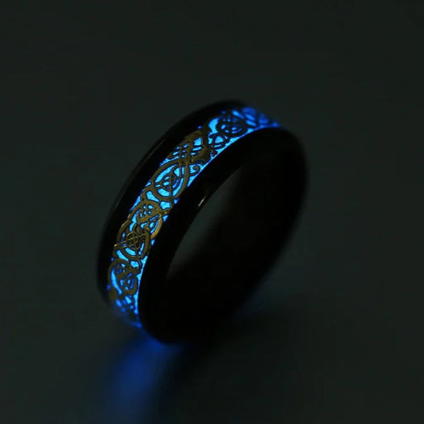 Glowing black ring with intricate design on a dark background